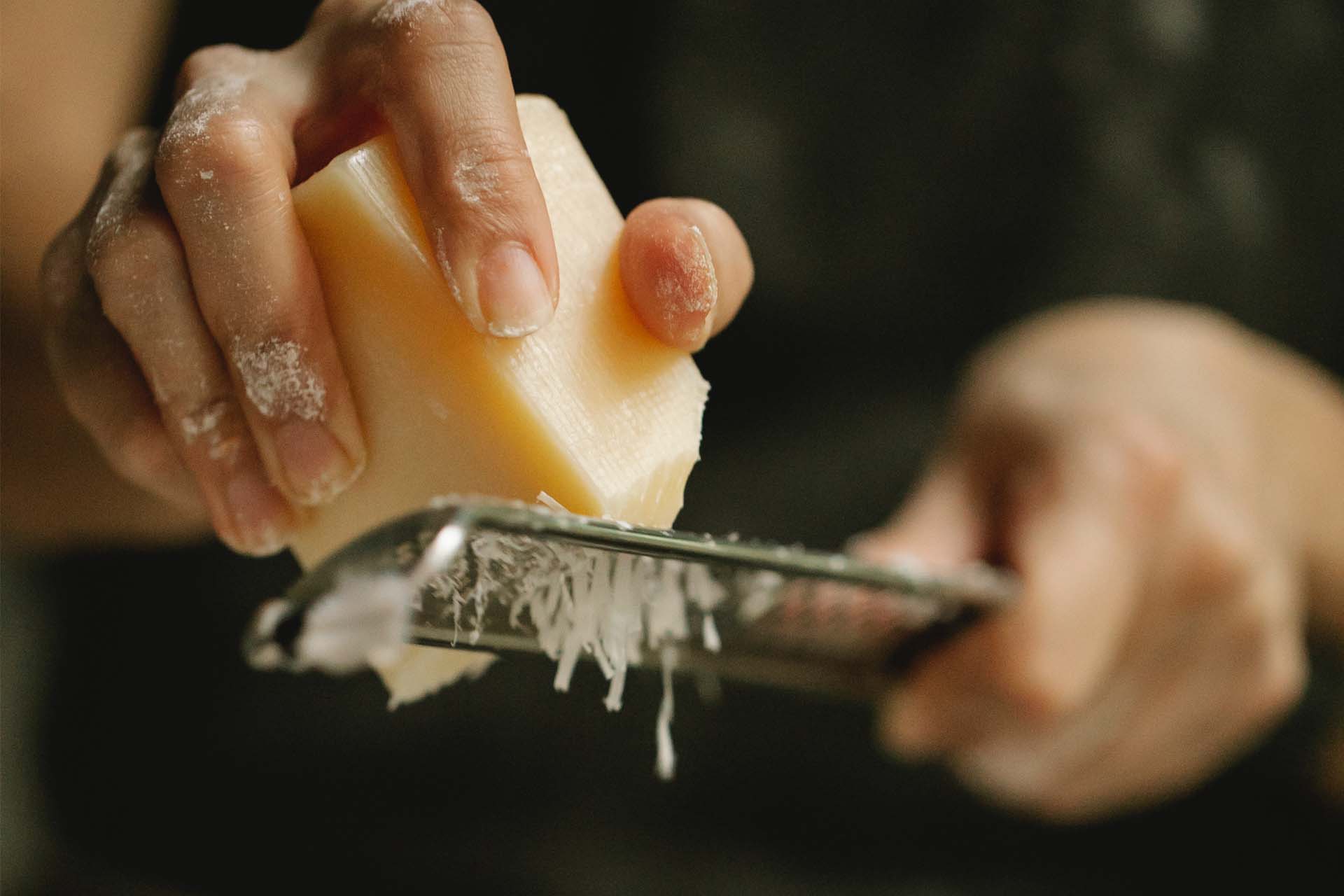 microplane grater grating parmesan cheese.