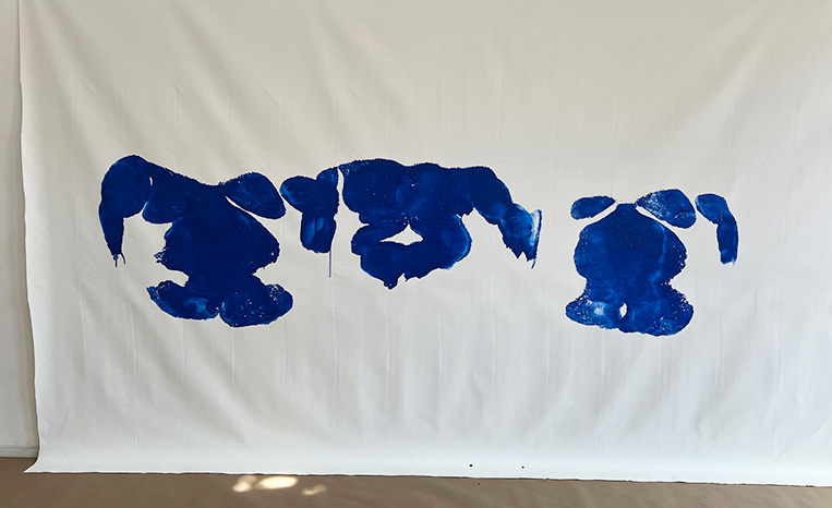 Blue paintings of Paul's body.